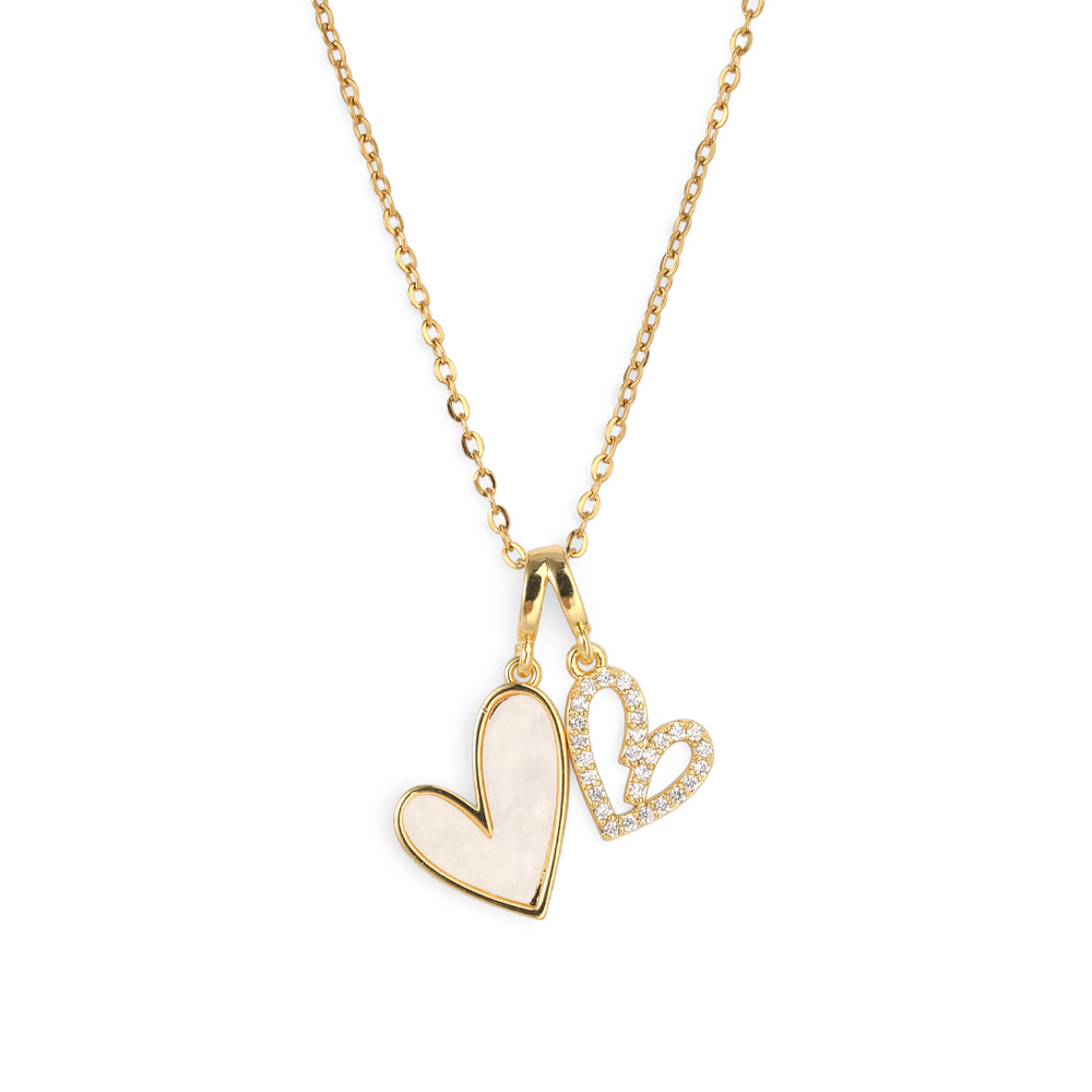 Gold necklace with a heart-shaped pendant on a white background