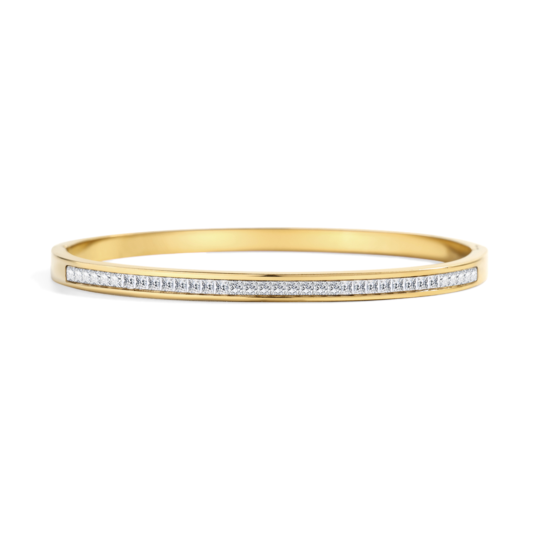 Gold bracelet with small diamonds on a light gray background