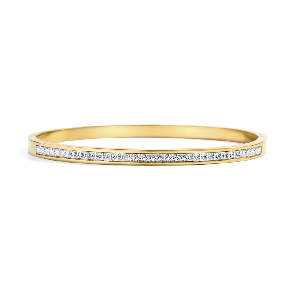 Gold bracelet with small diamonds on a light gray background