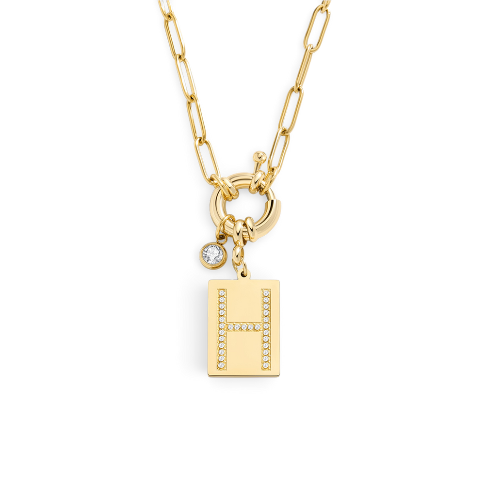 Gold necklace with letter 'H' pendant on a white background