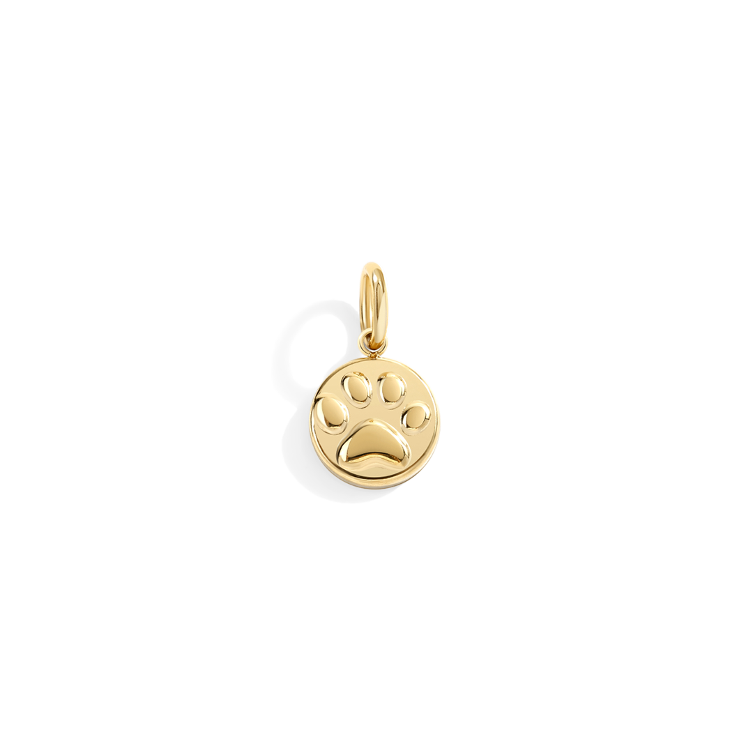 Gold paw print pendant on a white background