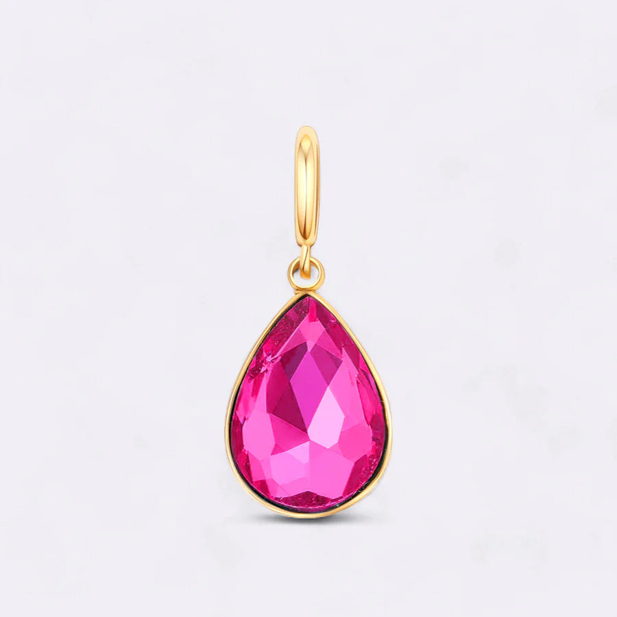 Gold pendant with a pink teardrop-shaped gemstone on a light gray background
