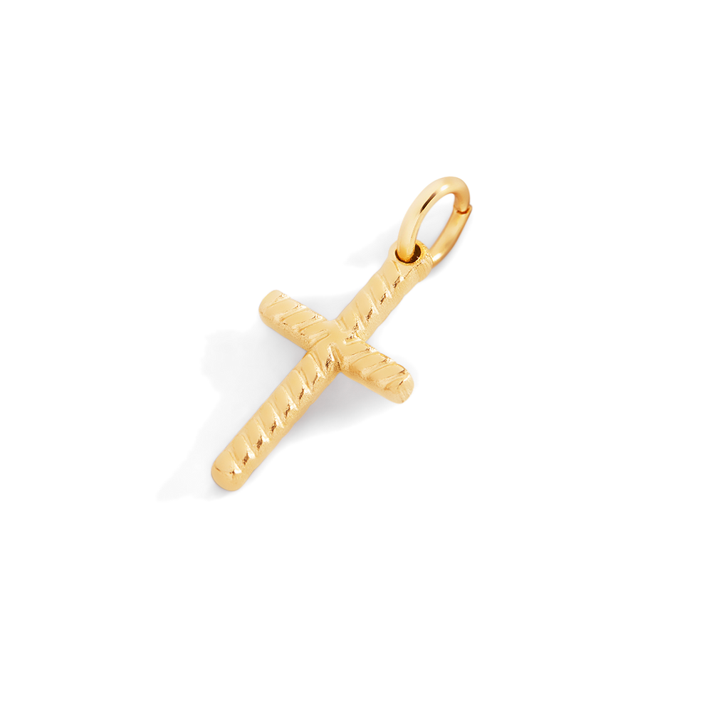 Gold cross pendant on a light gray background