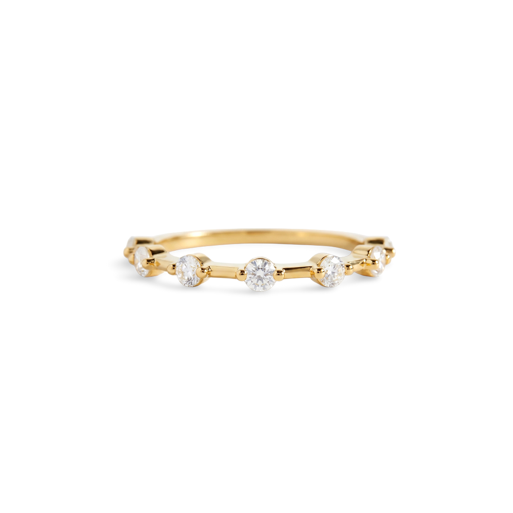 Gold ring with small diamonds on a white background