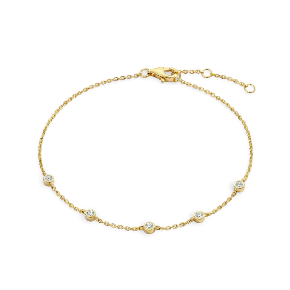 Gold bracelet with small diamonds on a light gray background