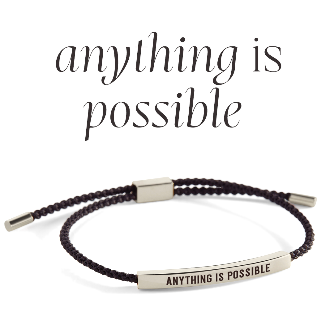 Bracelet with 'Anything is Possible' message on a light gray background