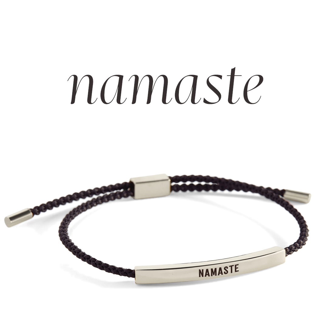 Bracelet with 'NAMASTE' engraving on a light background