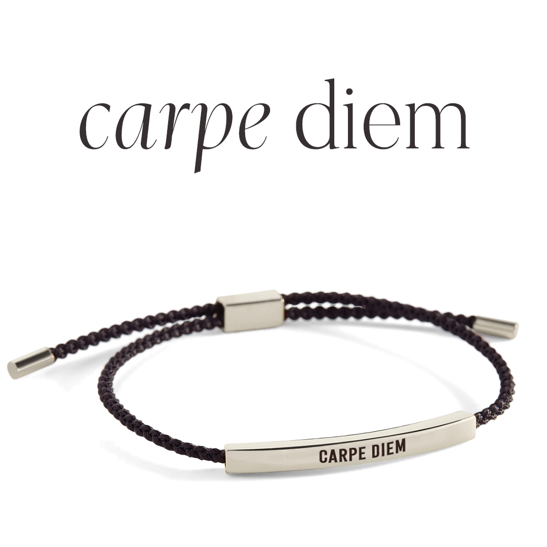 Bracelet with 'carpe diem' engraving on a light background