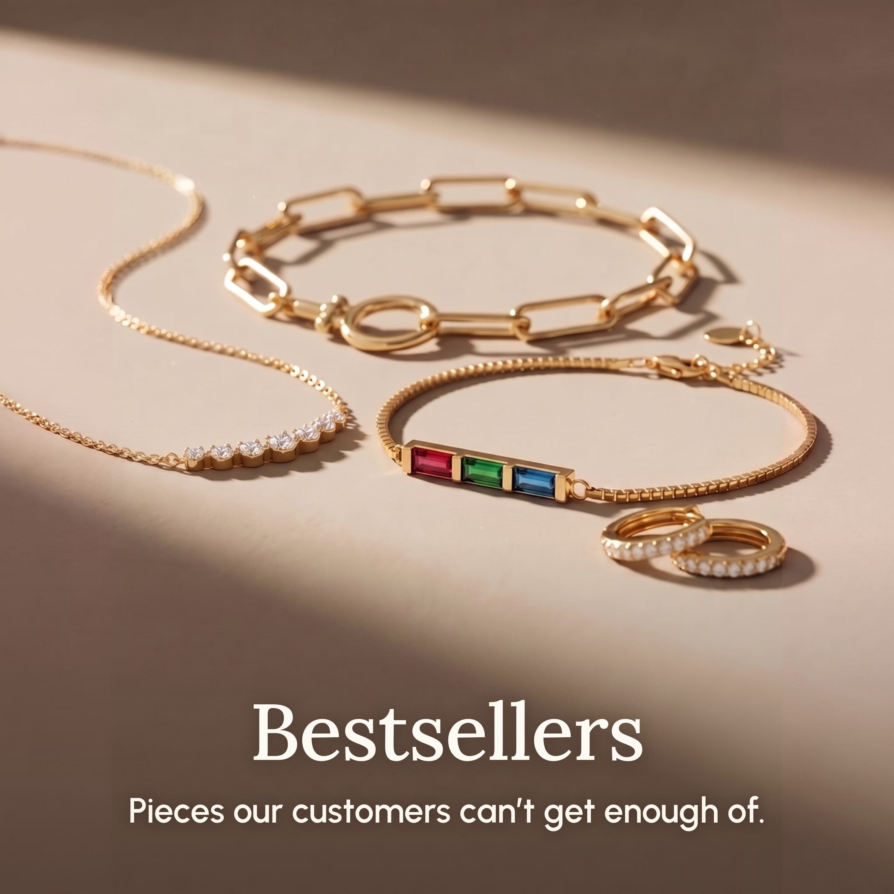 Bestsellers: gold bracelet and necklace flat lay on sand