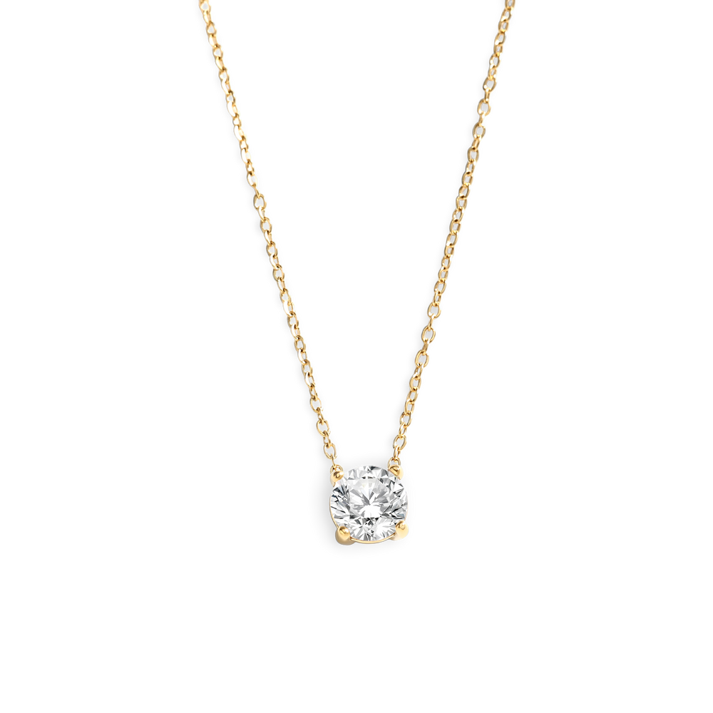 Gold necklace with a diamond pendant on a white background