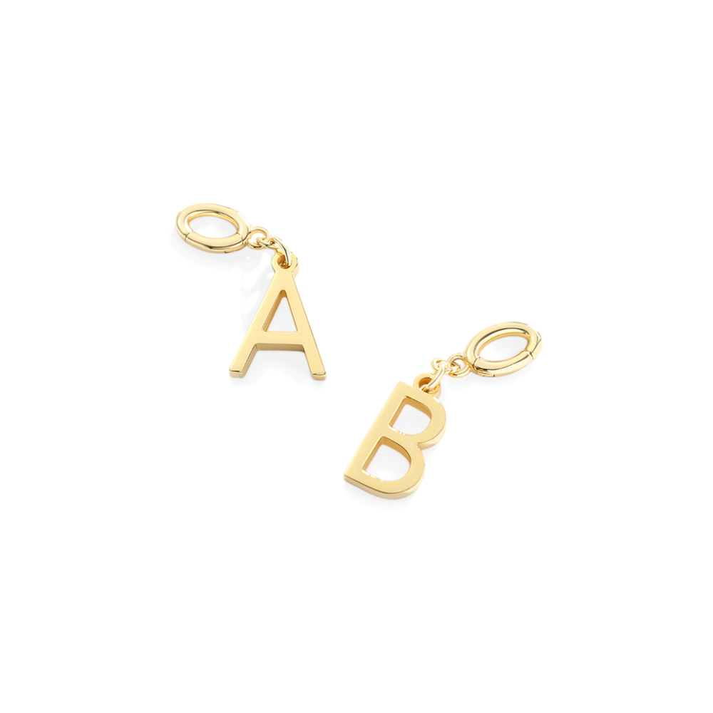 Gold letter 'A' and 'B' charms on a white background