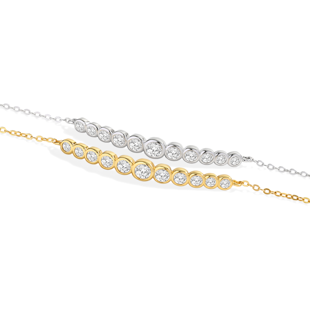 Two diamond bracelets, one gold and one silver, on a light gray background.