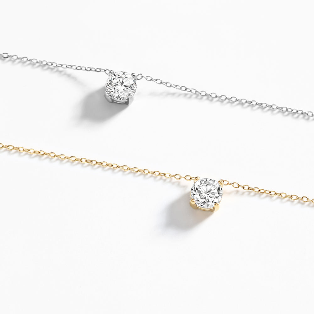 Two diamond necklaces on a white background