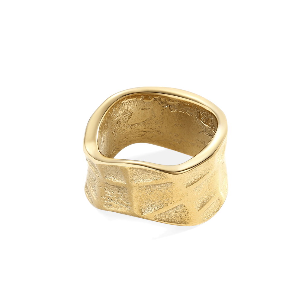 Gold ring with textured surface on a white background