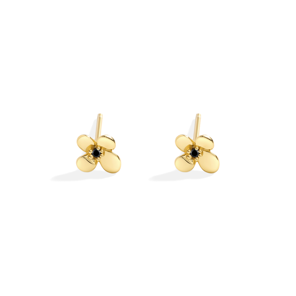Gold flower-shaped earrings with black centers on a white background