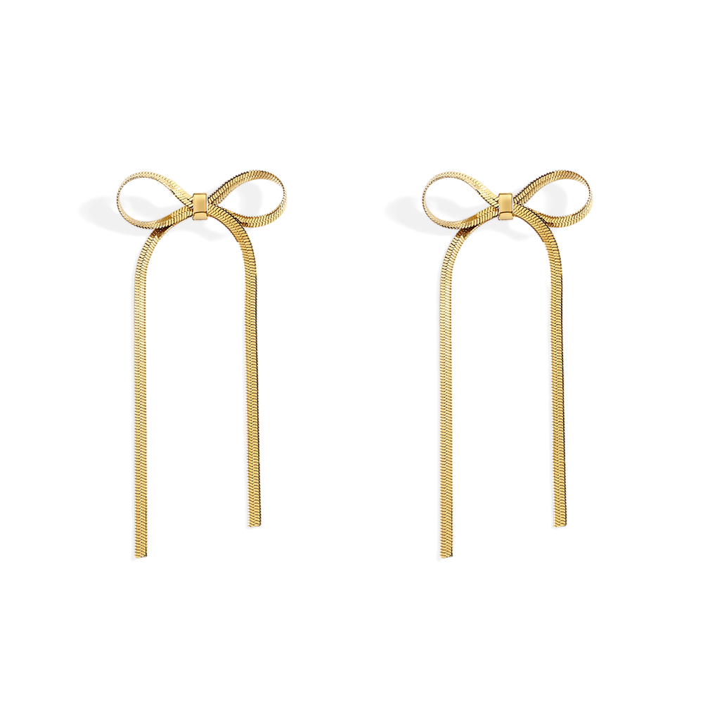 Gold bow-shaped earrings on a white background
