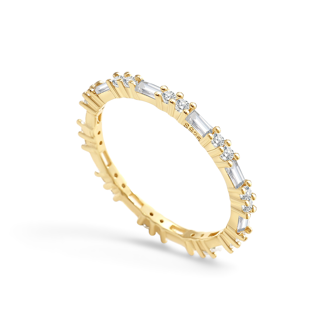 Gold ring with diamond accents on a white background