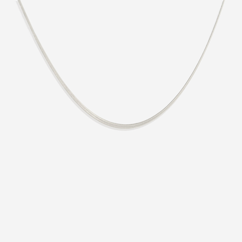 A sleek and timeless gold-colored herringbone chain necklace with a width of 2mm, displayed against a black background.