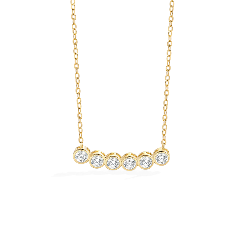 Gold necklace with five round diamonds on a white background