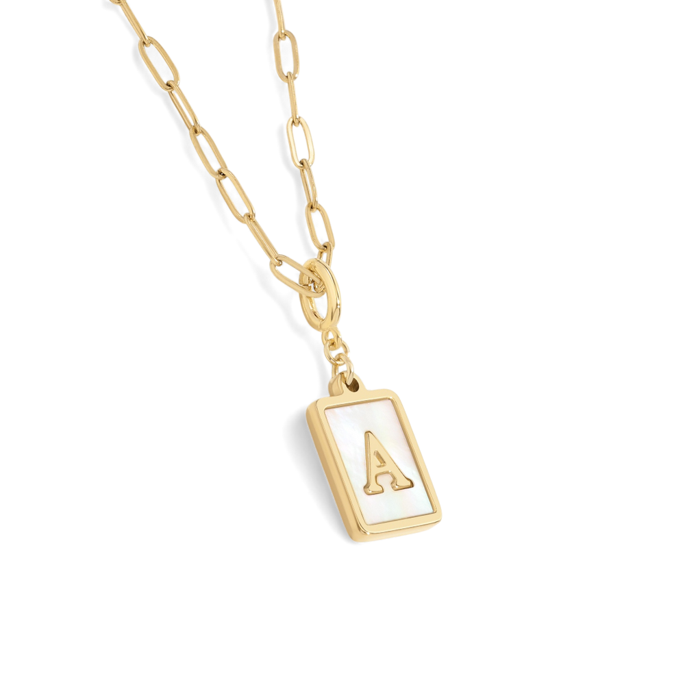Gold necklace with a rectangular pendant featuring a letter on a white background