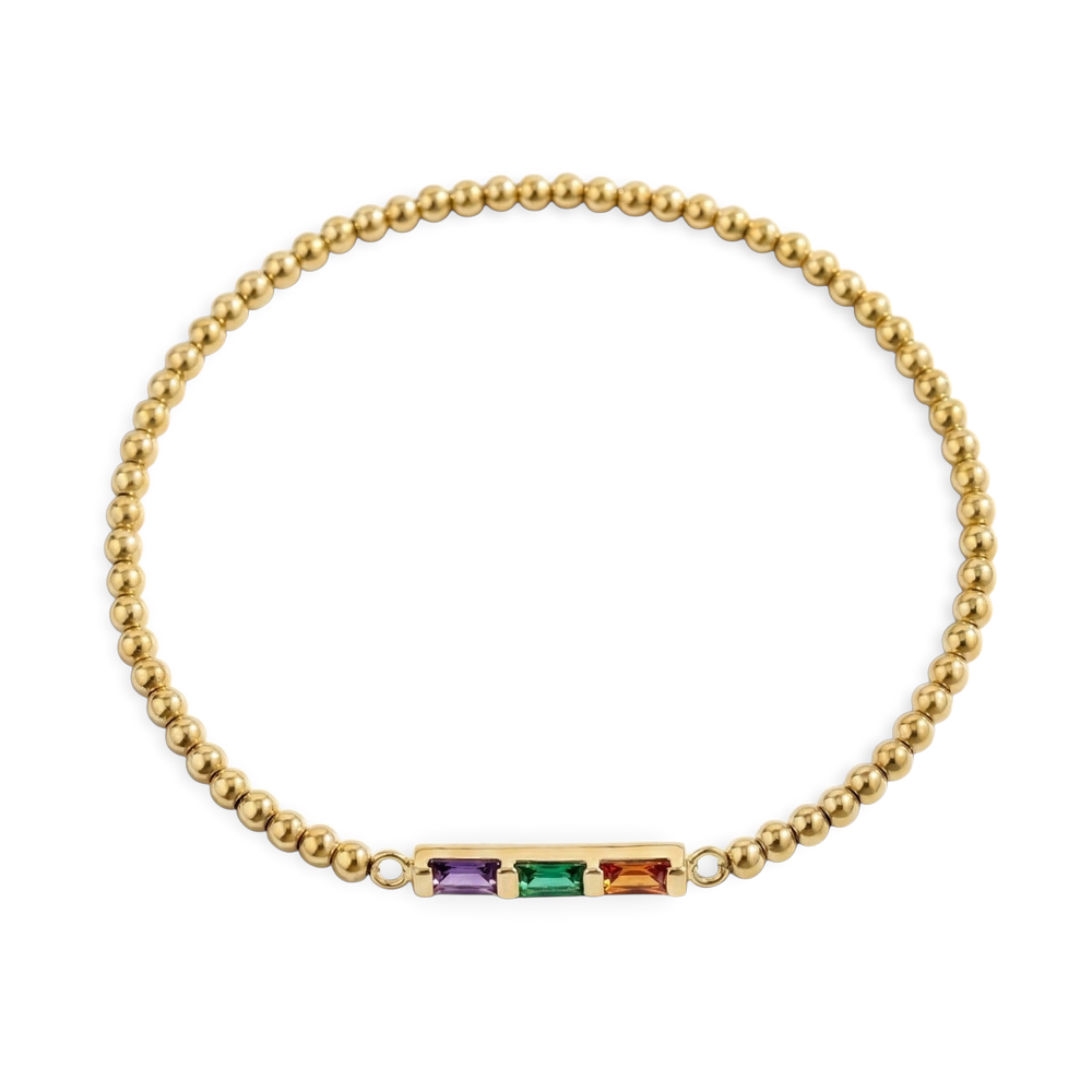 Gold bracelet with colorful gemstones on a white background