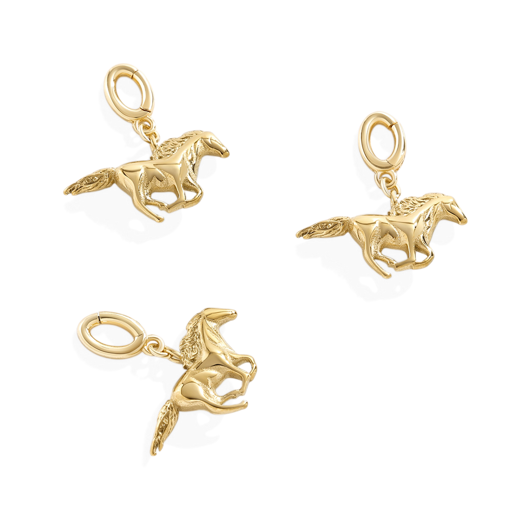 Three gold horse-shaped charms on a white background