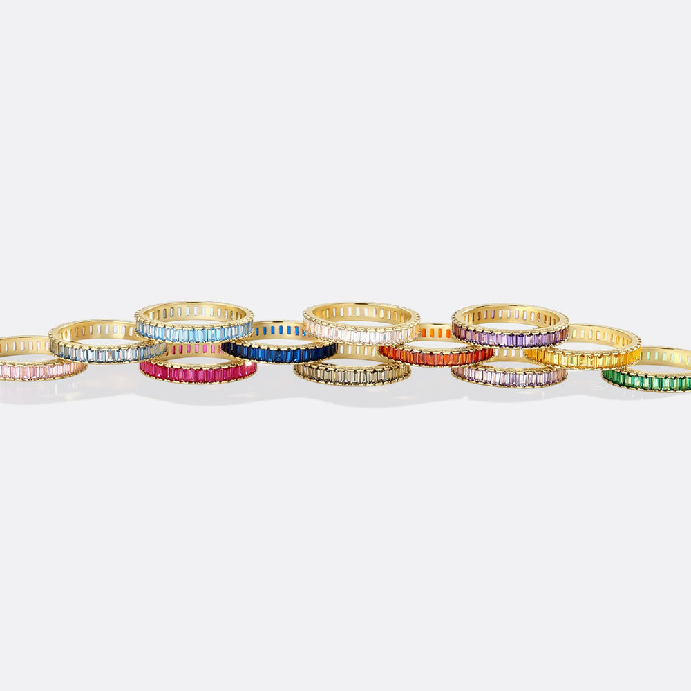 Colorful rings arranged in a line on a white background