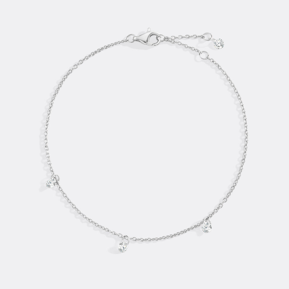 Silver anklet on a light gray background