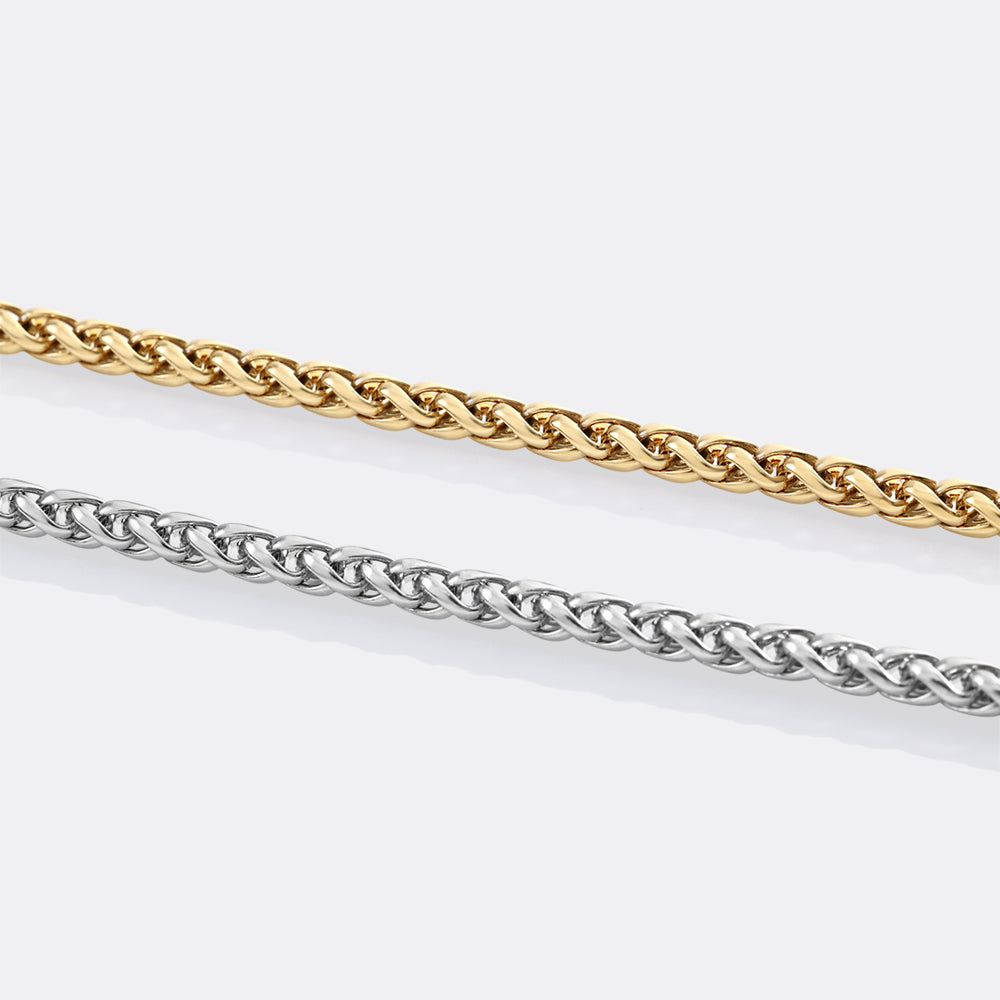 Gold and silver rope chain necklaces on a white background