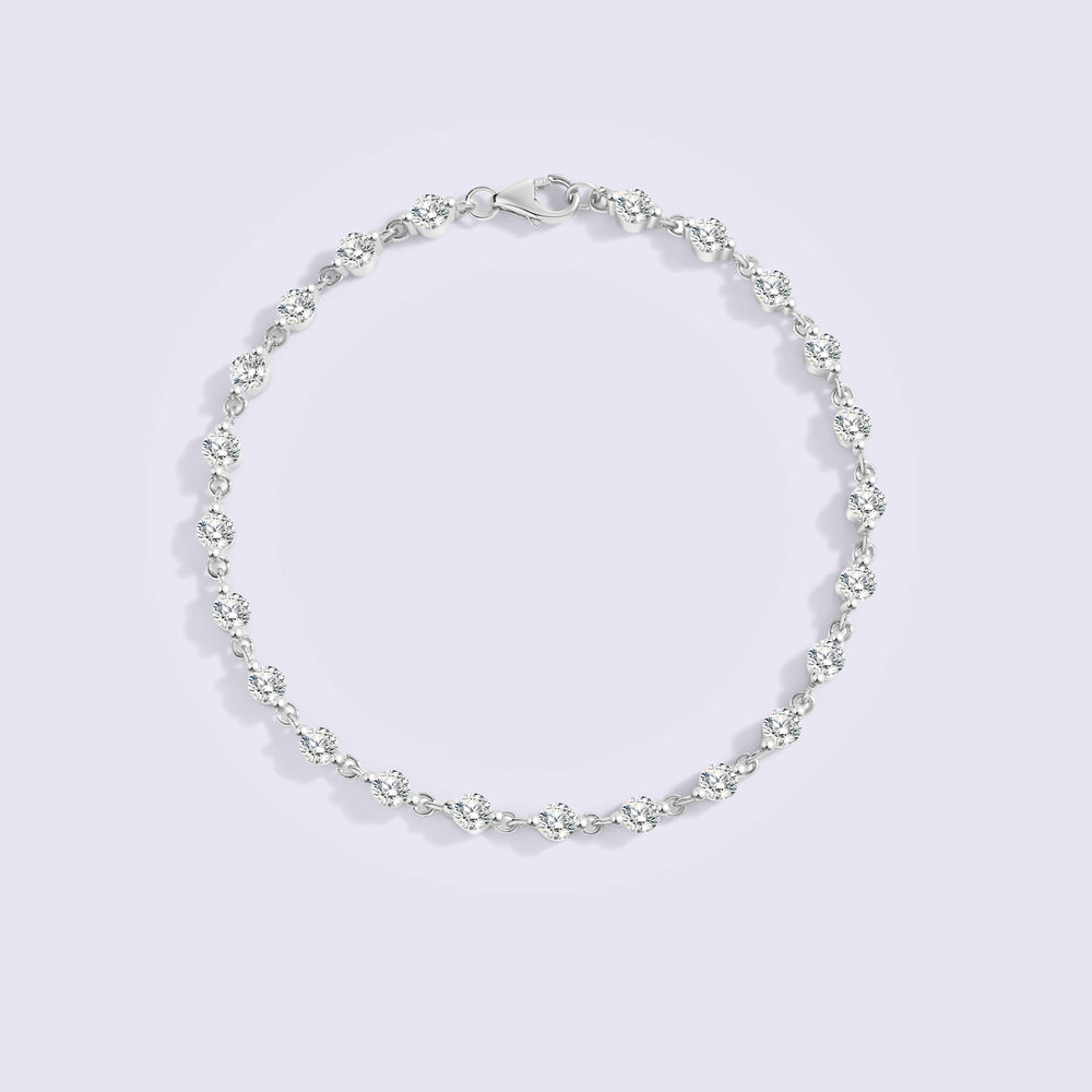 Silver bracelet on a light gray background