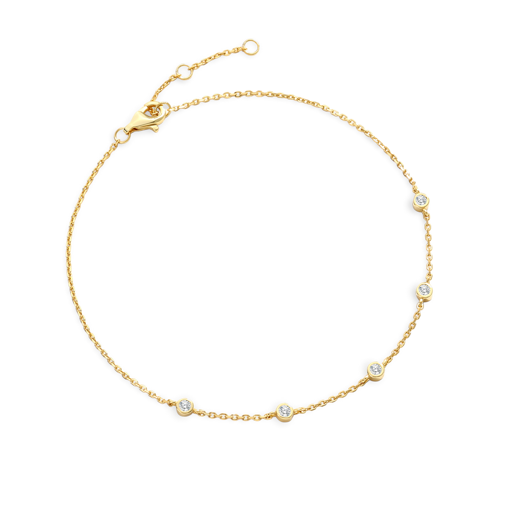 Gold bracelet with small diamonds on a light gray background