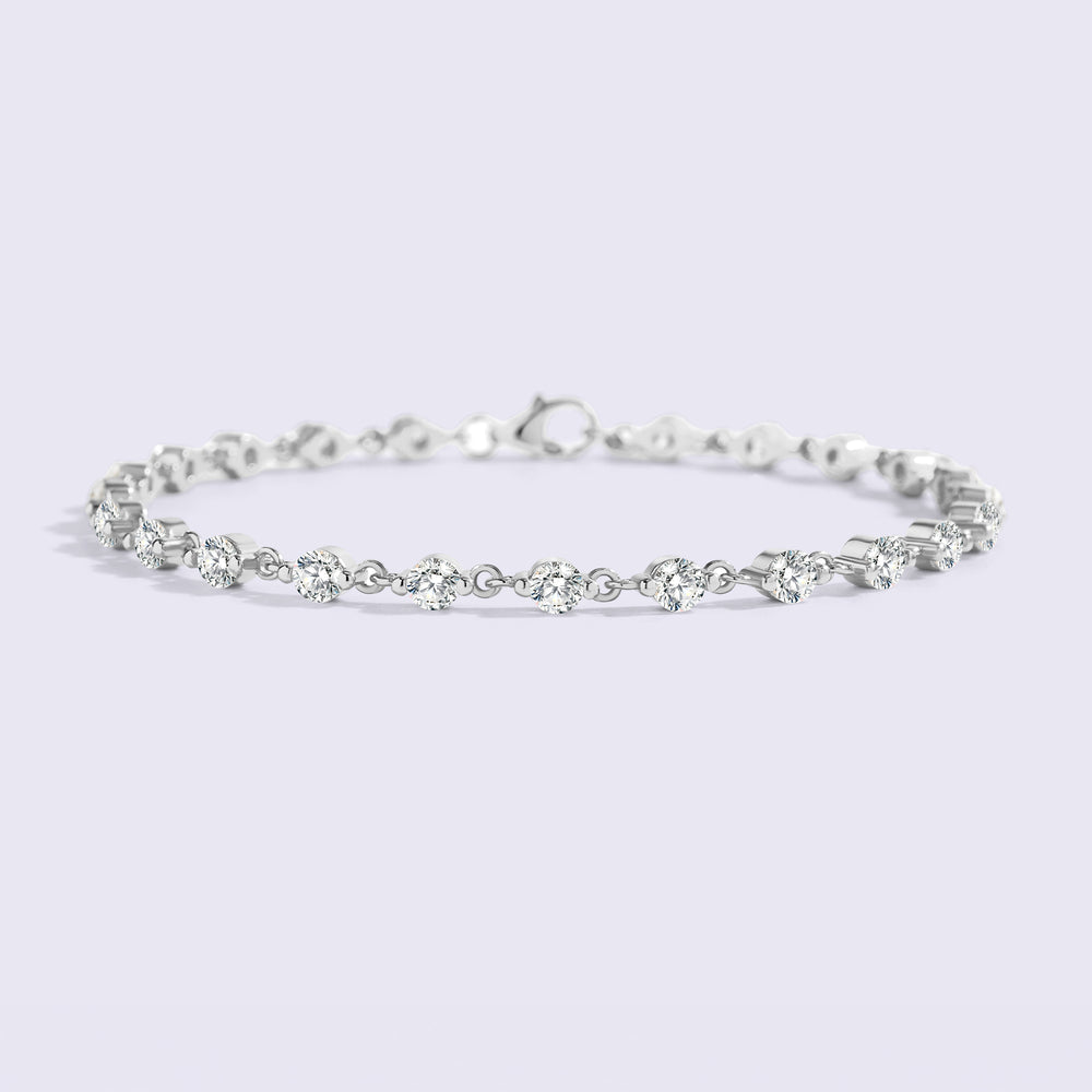 Silver bracelet on a light purple background