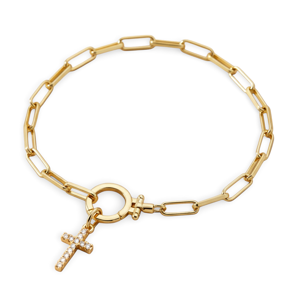 Gold chain bracelet with a cross charm on a white background