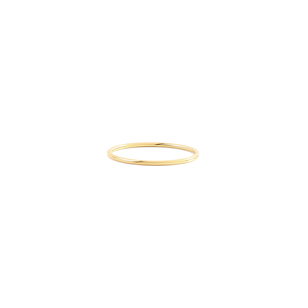 Gold ring on a light gray background