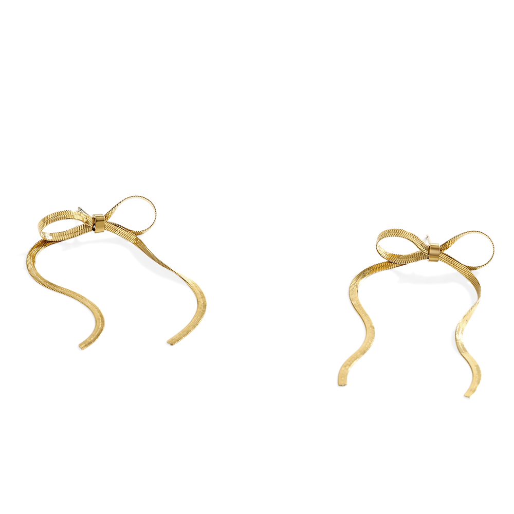 Gold bow-shaped earrings on a light gray background
