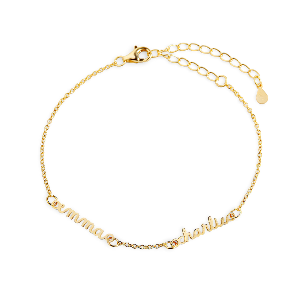 A gold-colored dainty cable chain bracelet with a lobster clasp, featuring multiple nameplates.