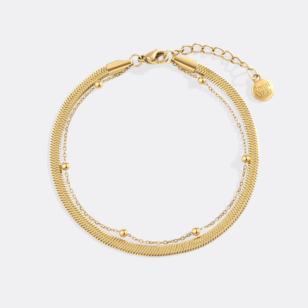 Gold bracelet on a white background