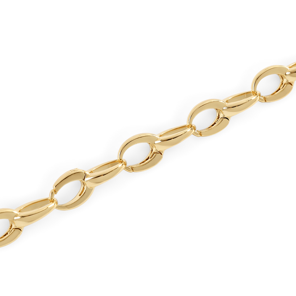 Gold chain bracelet on a light gray background
