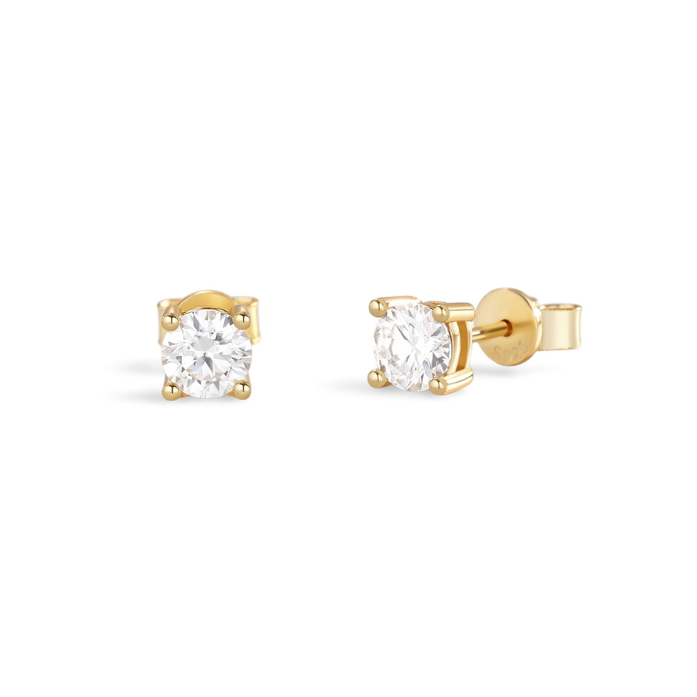 A pair of classic diamond solitaire earrings set in gold.