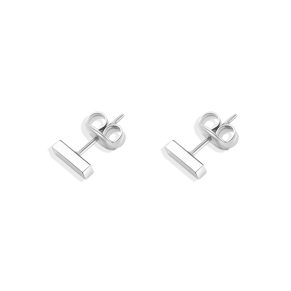 A pair of dainty bar stud earrings made of 18k gold over stainless steel, displayed against a black background.