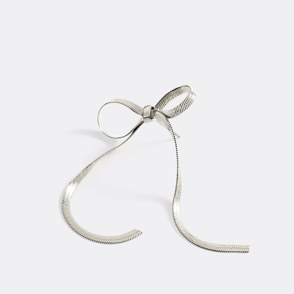 Silver hoop earring on a white background