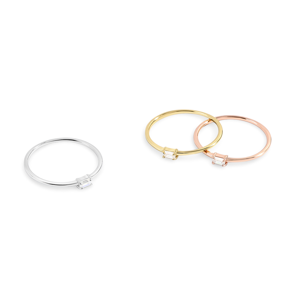 Three bangles in silver, gold, and rose gold on a white background