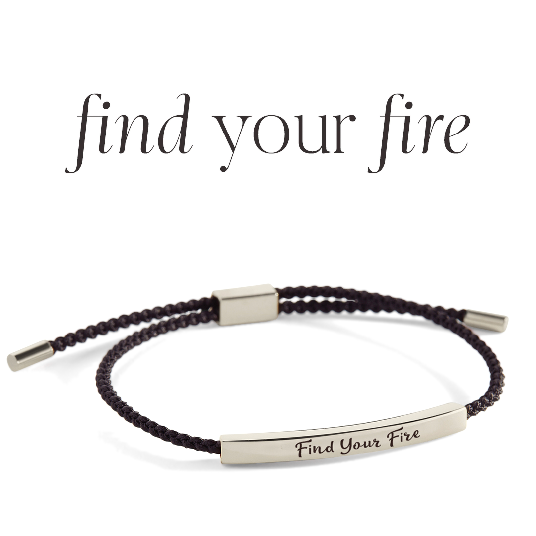 Bracelet with 'Find Your Fire' engraving on a light background