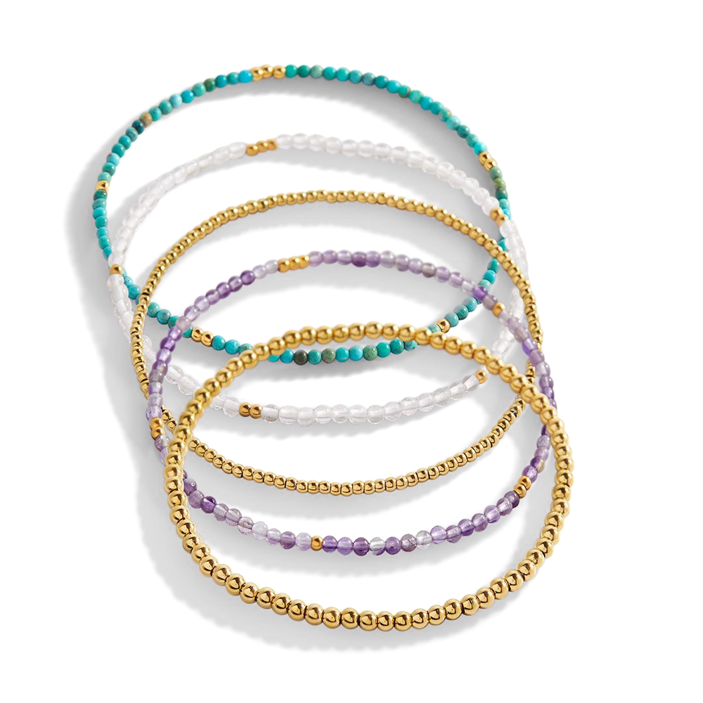 Set of multicolored beaded bracelets on a white background