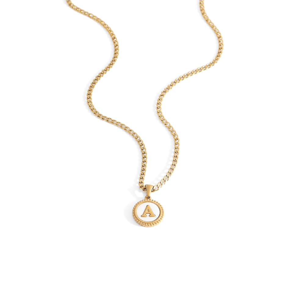 A gold-colored Cuban chain necklace with a mother of pearl disc pendant.