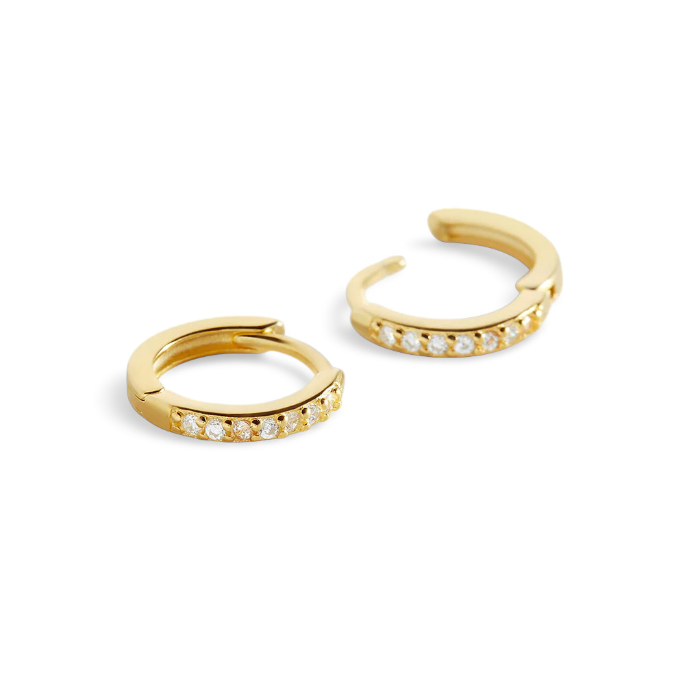 Gold hoop earrings with embedded stones on a light gray background