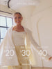 Video banner of a model wearing jewelry in a bright studio. Text on the banner spring sale