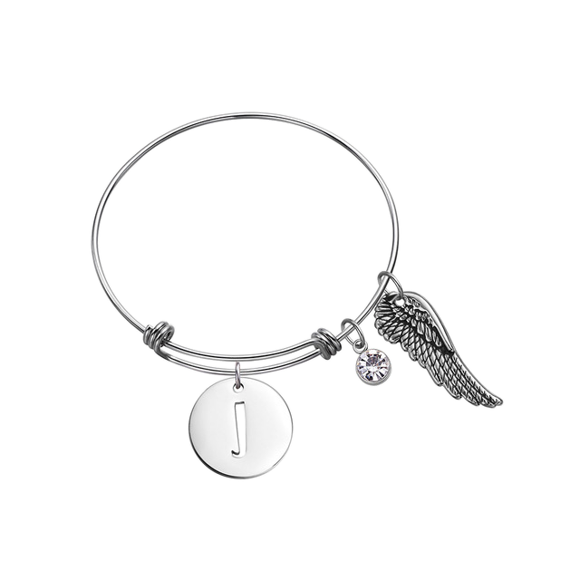 Silver bracelet with angel wing and letter 'J' charm on a white background